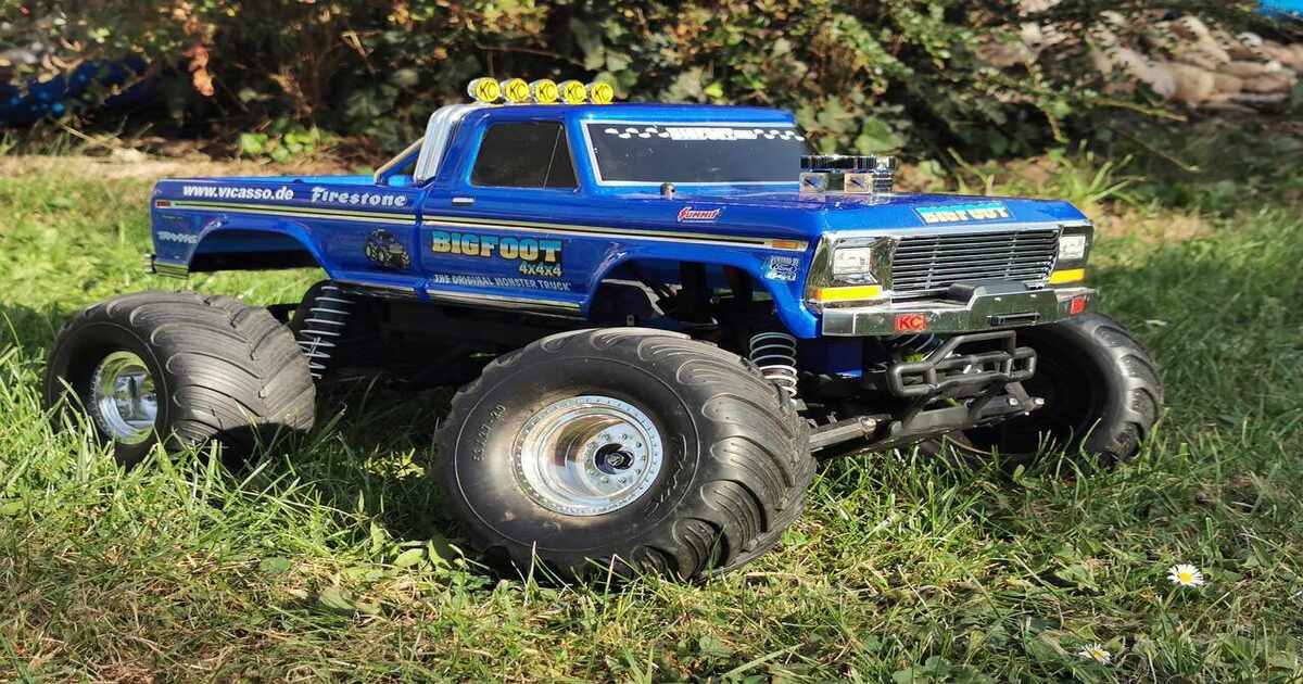 A Traxxas RC monster truck on a grass field.