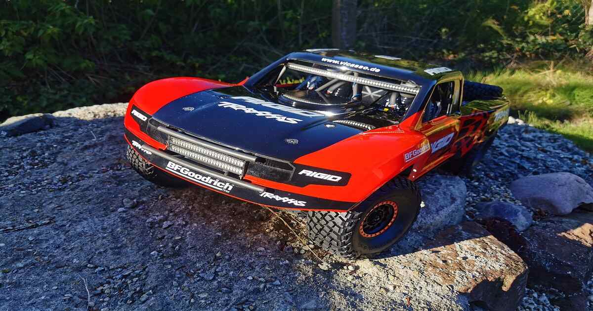 Traxxas RC car parked off-road.