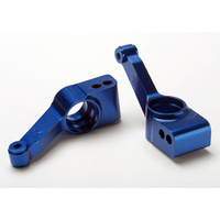 TRAXXAS 1952X: Carriers, stub axle (blue-anodized 6061-T6 aluminum)(rear)(2)